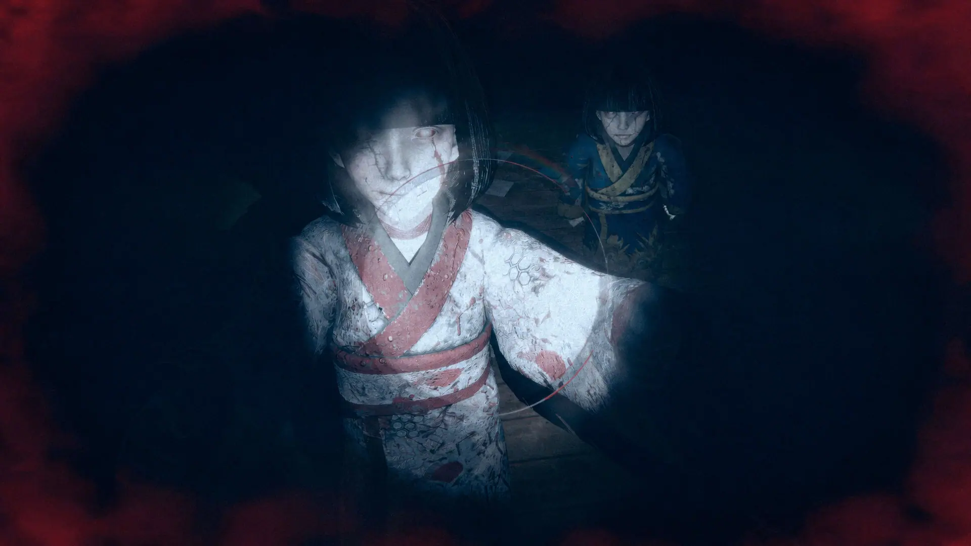 A ghostly girl in a white kimono emerges from the darkness.